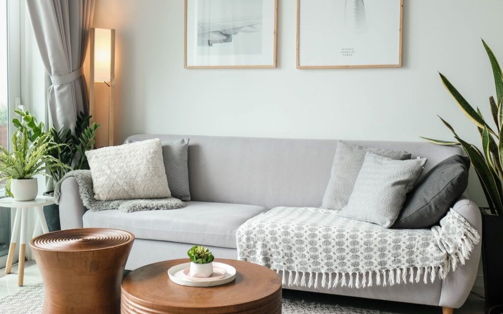 Living room with grey couch and wood coffee table